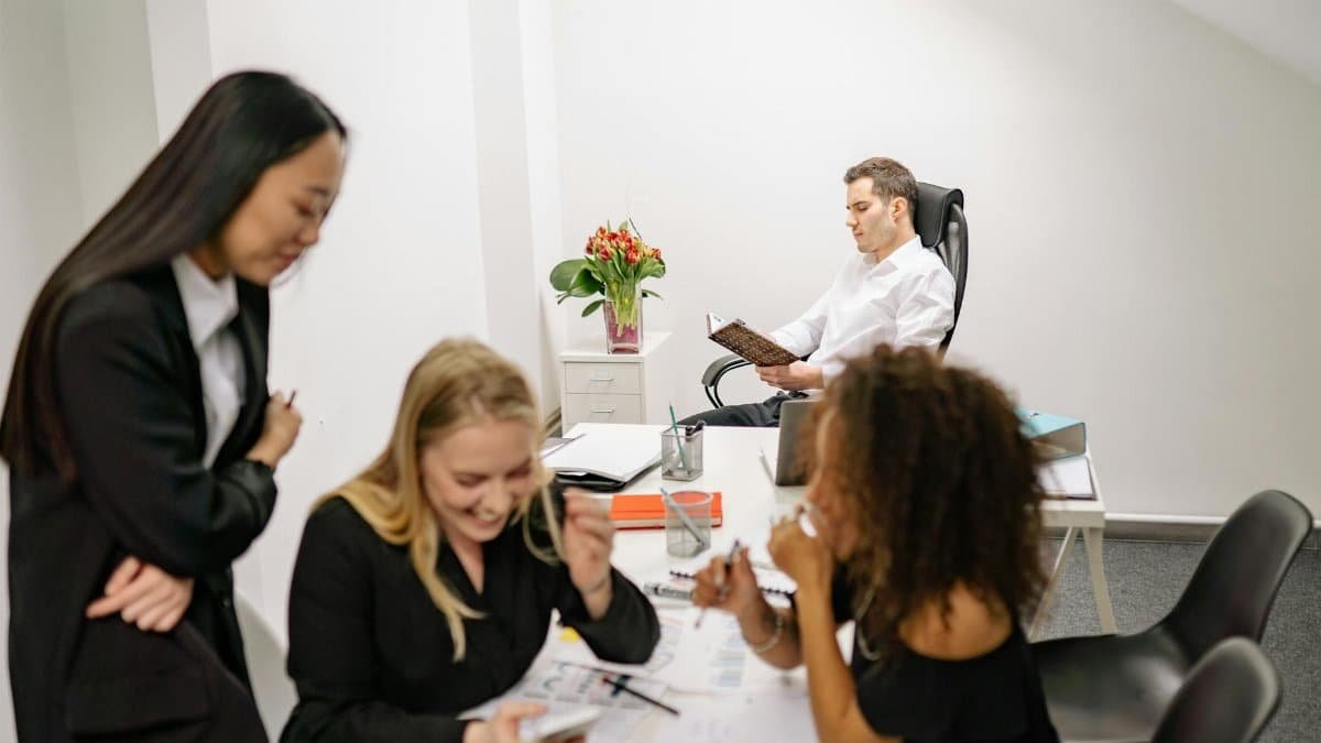 A diverse group of professionals collaborating in a modern office environment.