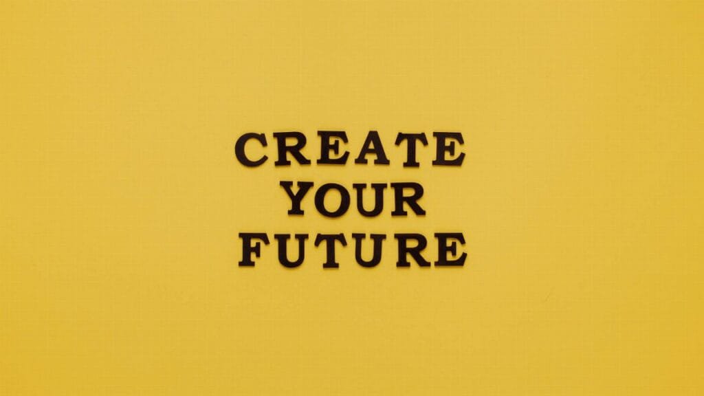 Bold text 'CREATE YOUR FUTURE' on minimalist yellow background. Inspiring design.