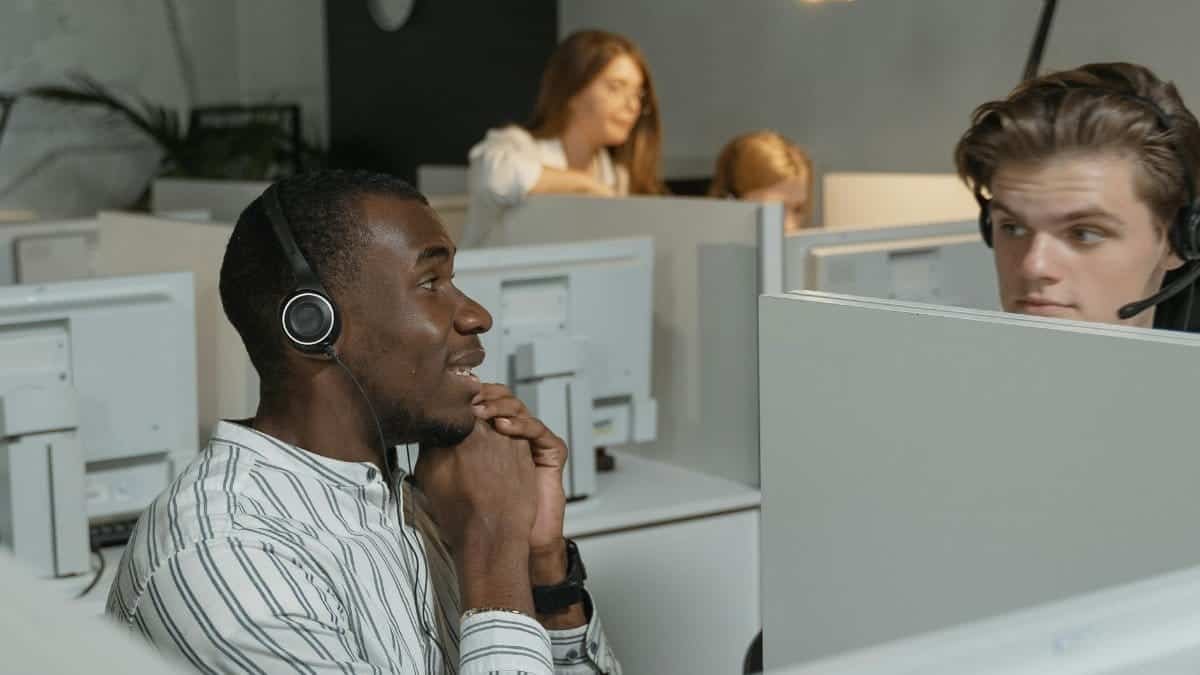 Call center team collaborating with headsets, providing efficient customer support.