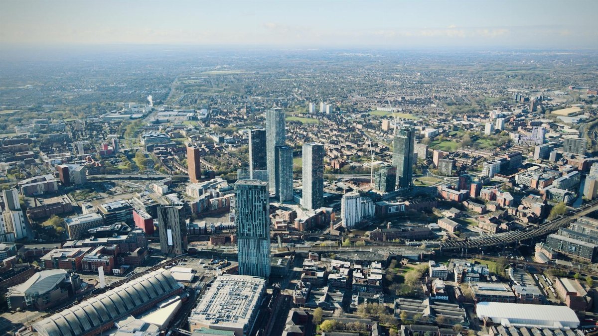 Stunning aerial shot of Manchester's skyline highlighting modern architecture and urban landscape.