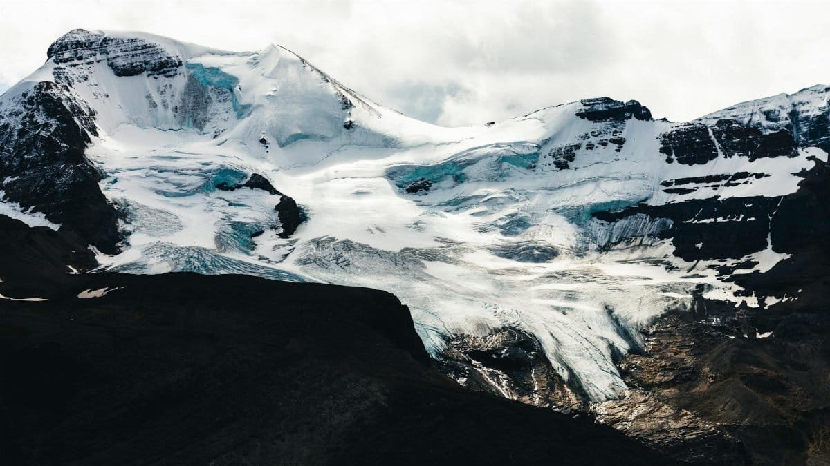 Breathtaking view of a glacier-covered mountain in Jasper National Park, Canada.