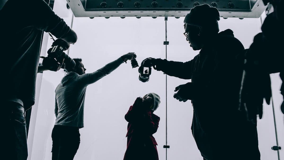 Silhouetted photography session with model and photographers in Chicago studio.