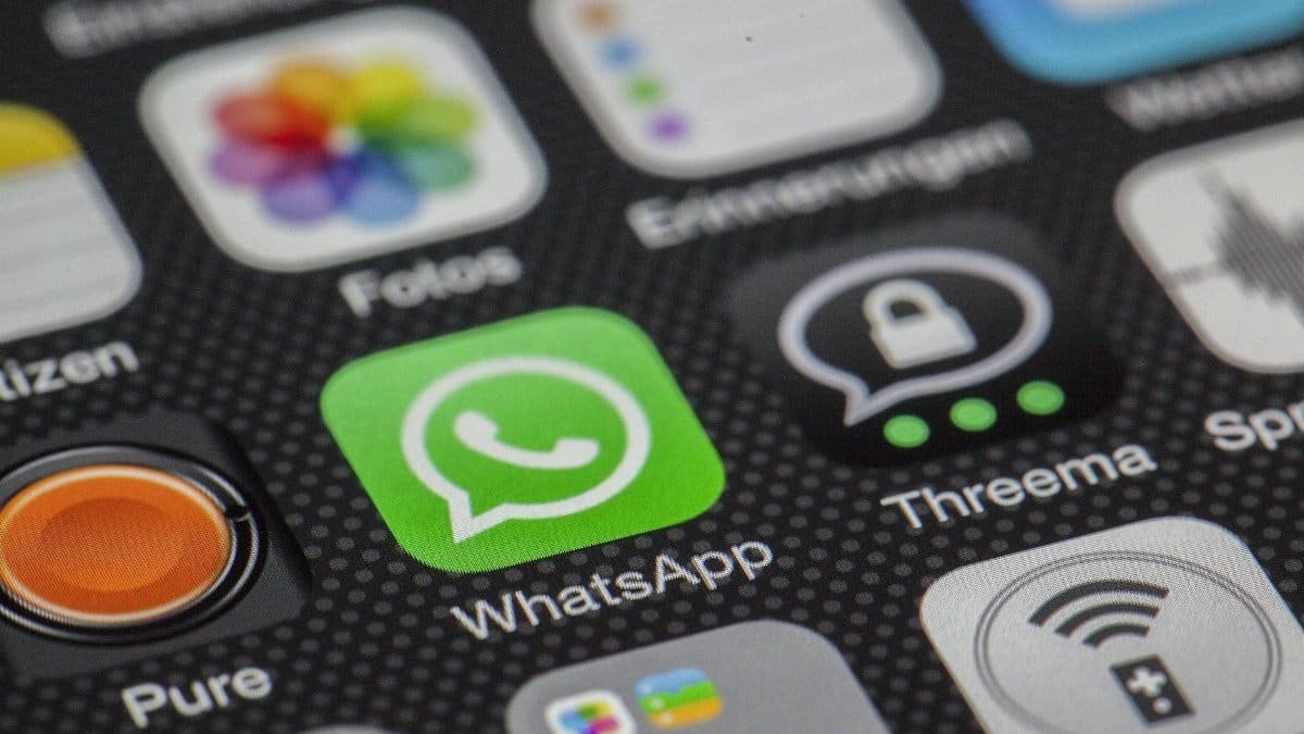 Detailed macro of smartphone screen showcasing popular app icons like WhatsApp.
