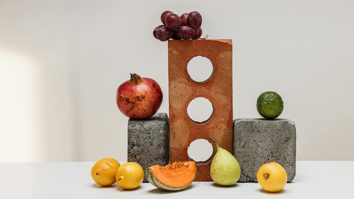 Vibrant display of fruits on concrete blocks, highlighting fresh and healthy choices.