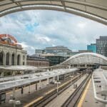 A striking view of Denver Union Station showcasing its modern architecture and urban surroundings.
