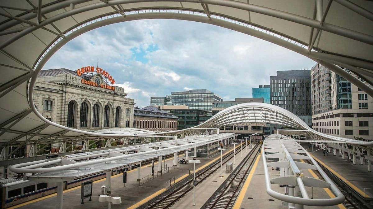 A striking view of Denver Union Station showcasing its modern architecture and urban surroundings.