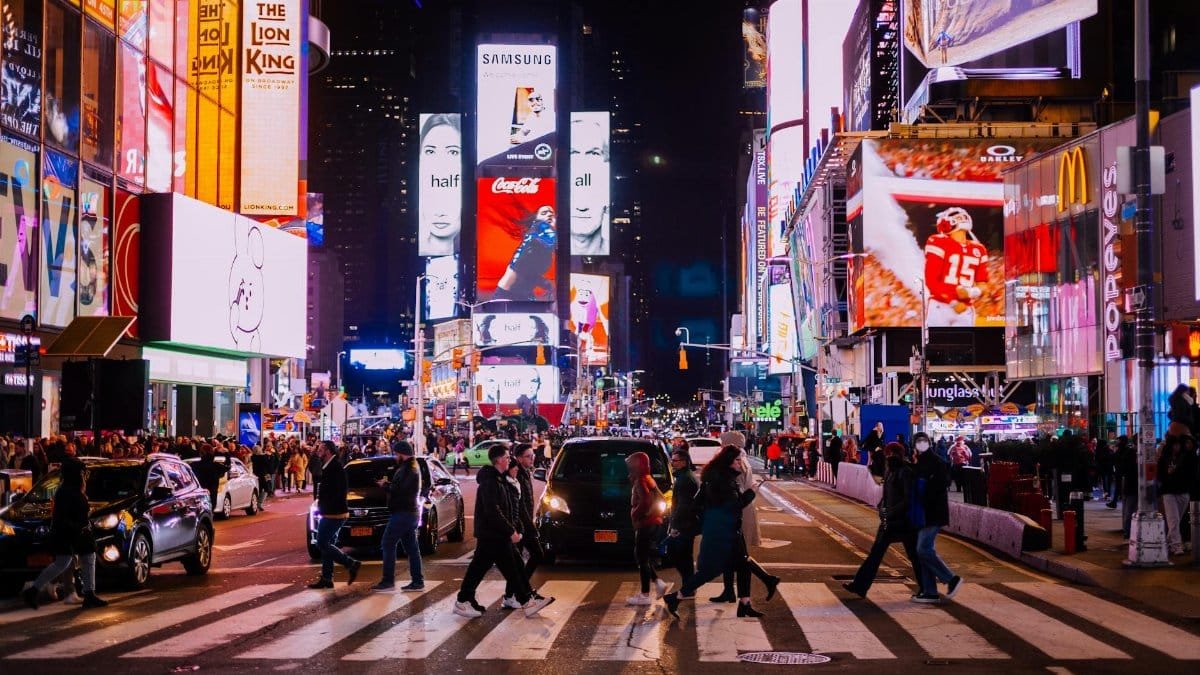 A lively evening in Times Square, New York, capturing the city's iconic billboards and bustling crowds.