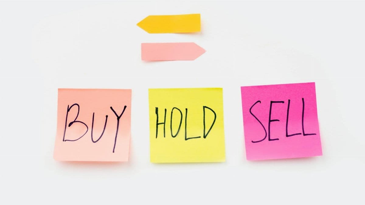 Colorful sticky notes with financial terms 'Buy', 'Hold', and 'Sell' on a clean white backdrop.