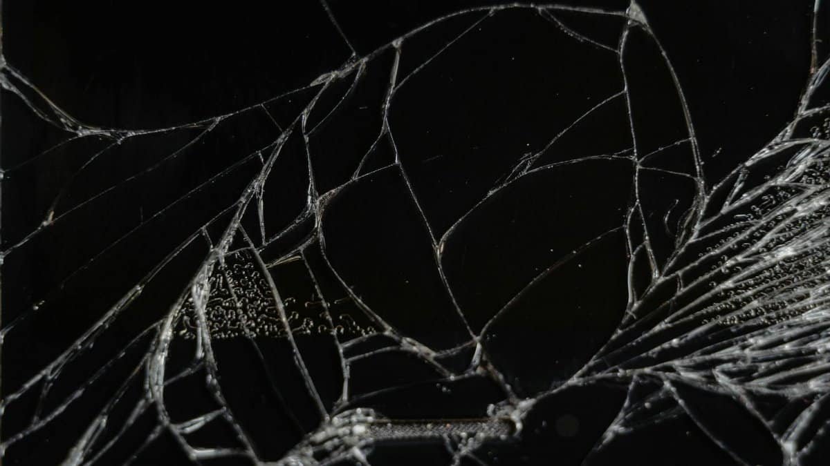 Close-up view of shattered glass showing delicate fragments and patterns.
