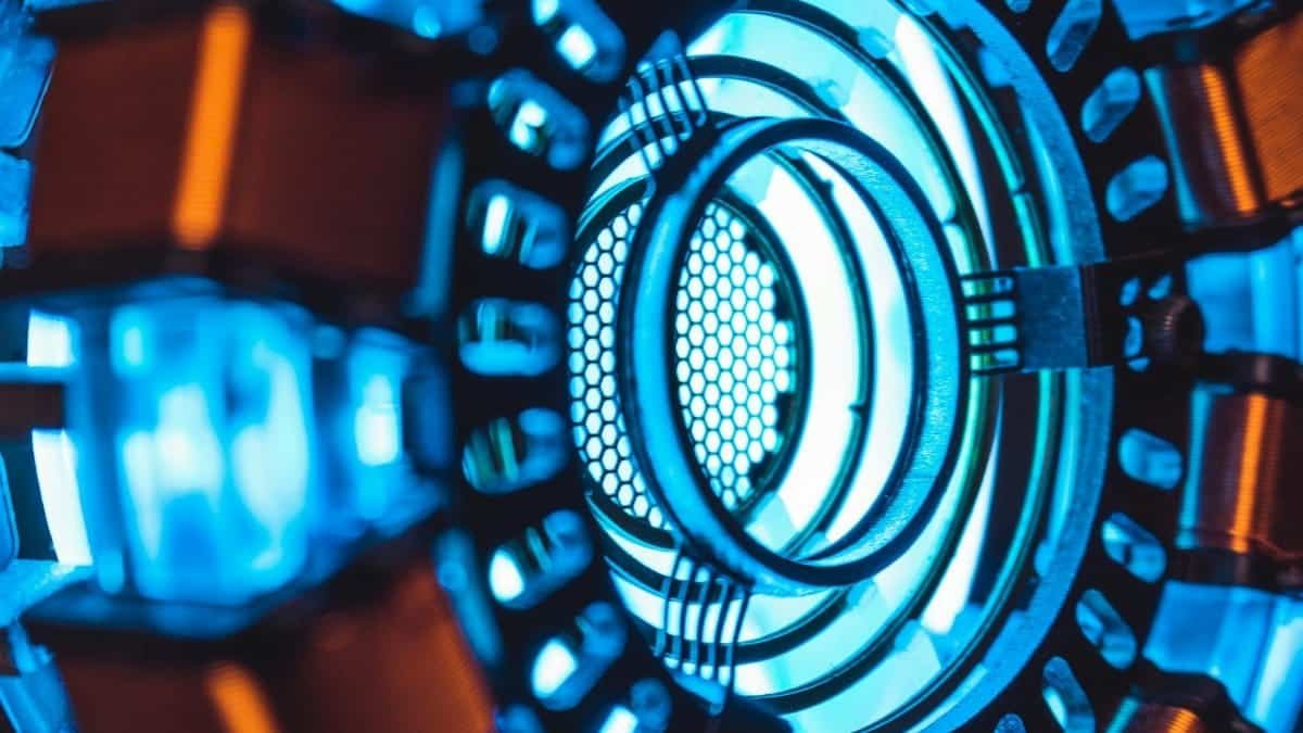 A detailed close-up of a glowing blue technology component with intricate designs.