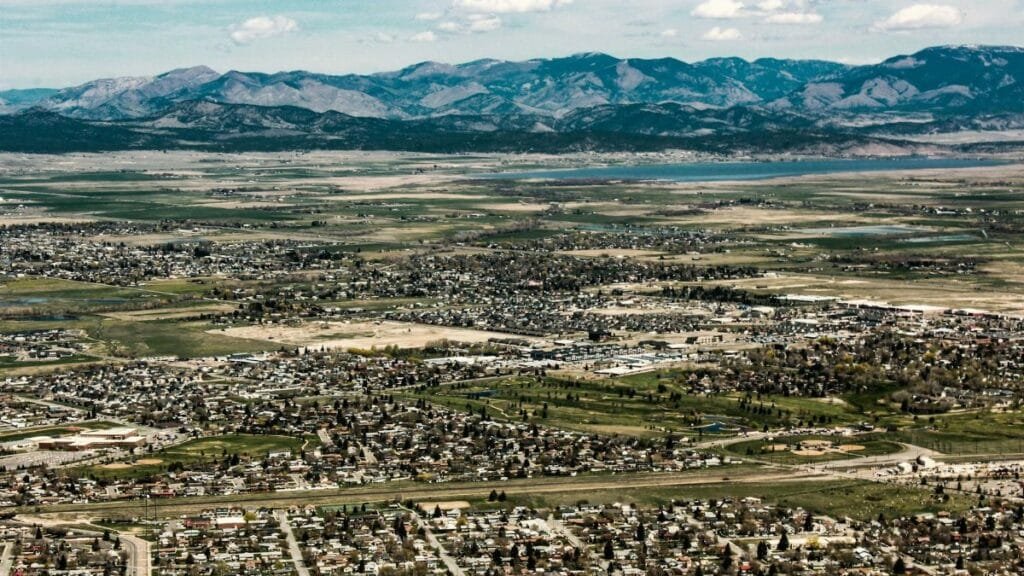 Explore the scenic landscape of Helena, Montana with vast fields and mountain views.