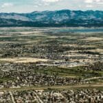 Explore the scenic landscape of Helena, Montana with vast fields and mountain views.