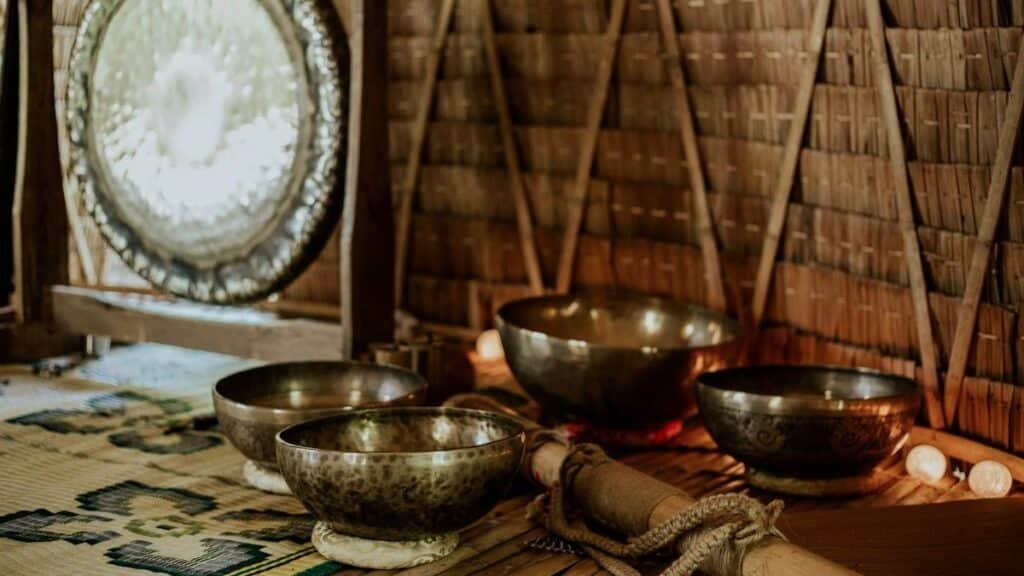 Tibetan singing bowls and gong for meditation and sound healing rituals.