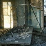 Explore the eerie beauty of a decaying room in a derelict house, captured in Minnesota.