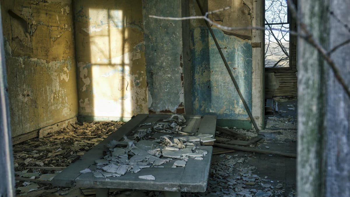 Explore the eerie beauty of a decaying room in a derelict house, captured in Minnesota.