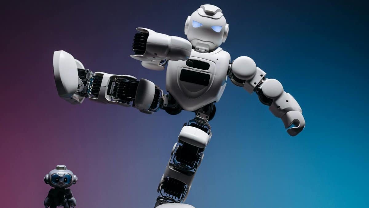 Close-up of two futuristic robots in a studio setting, showcasing advanced robotics and innovation.