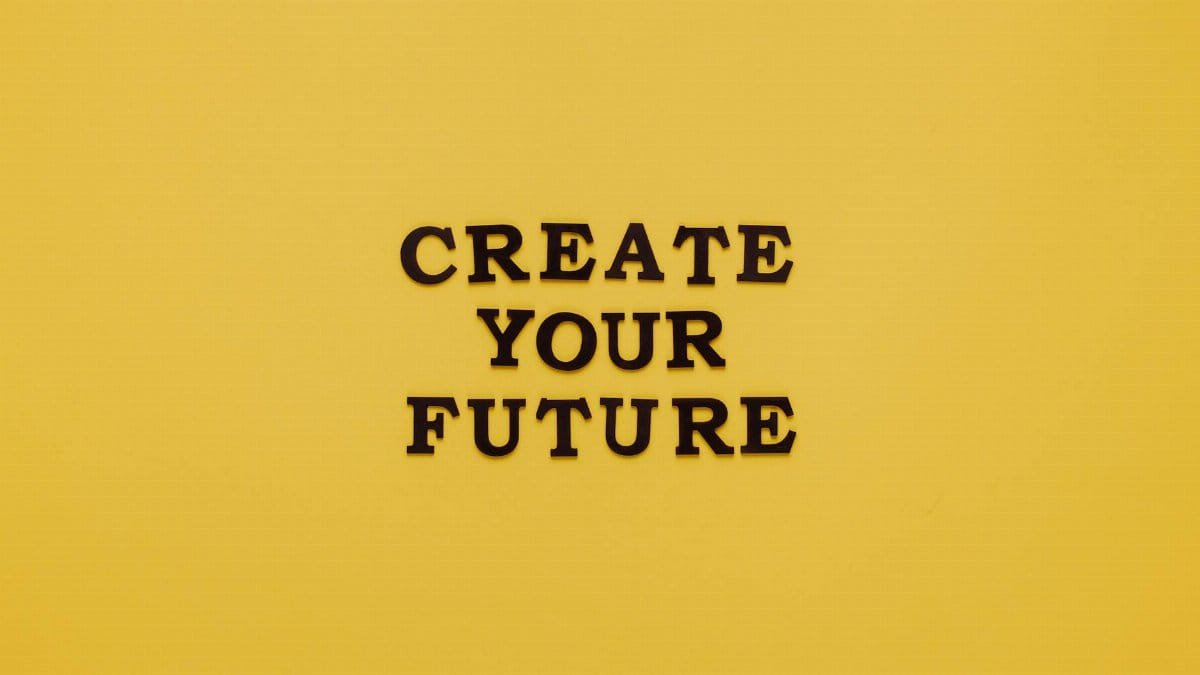 Bold text 'CREATE YOUR FUTURE' on minimalist yellow background. Inspiring design.