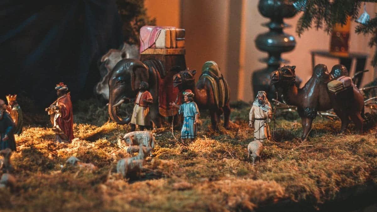 Nativity scene with miniature figurines of people demonstrating Birth of Christ placed in church