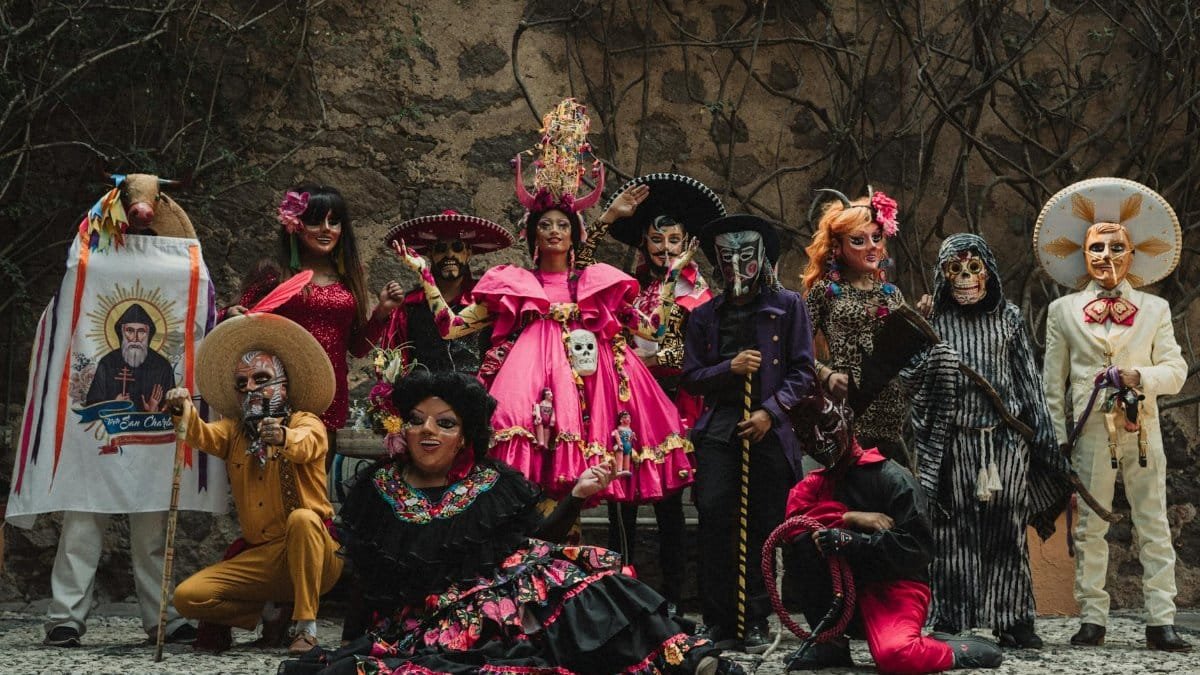 Vibrant costumes and masks at a cultural festival in Guanajuato, Mexico, capturing traditional and artistic expressions.