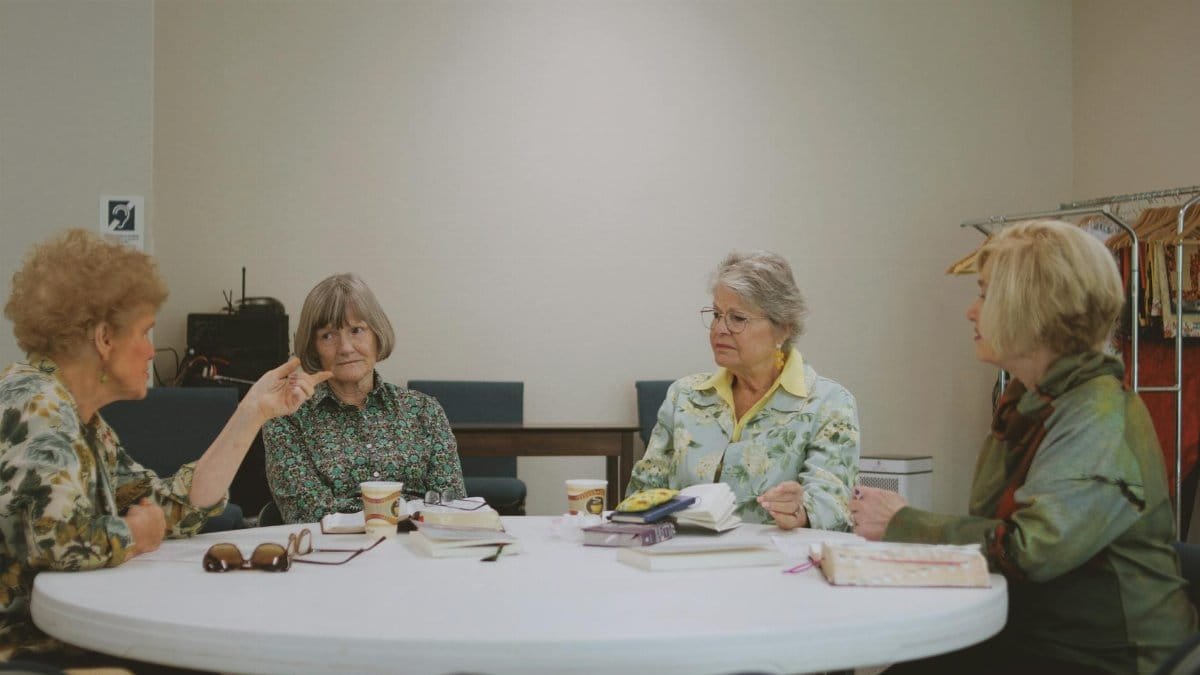 Senior women engage in a Bible study session at a community church in Brevard.