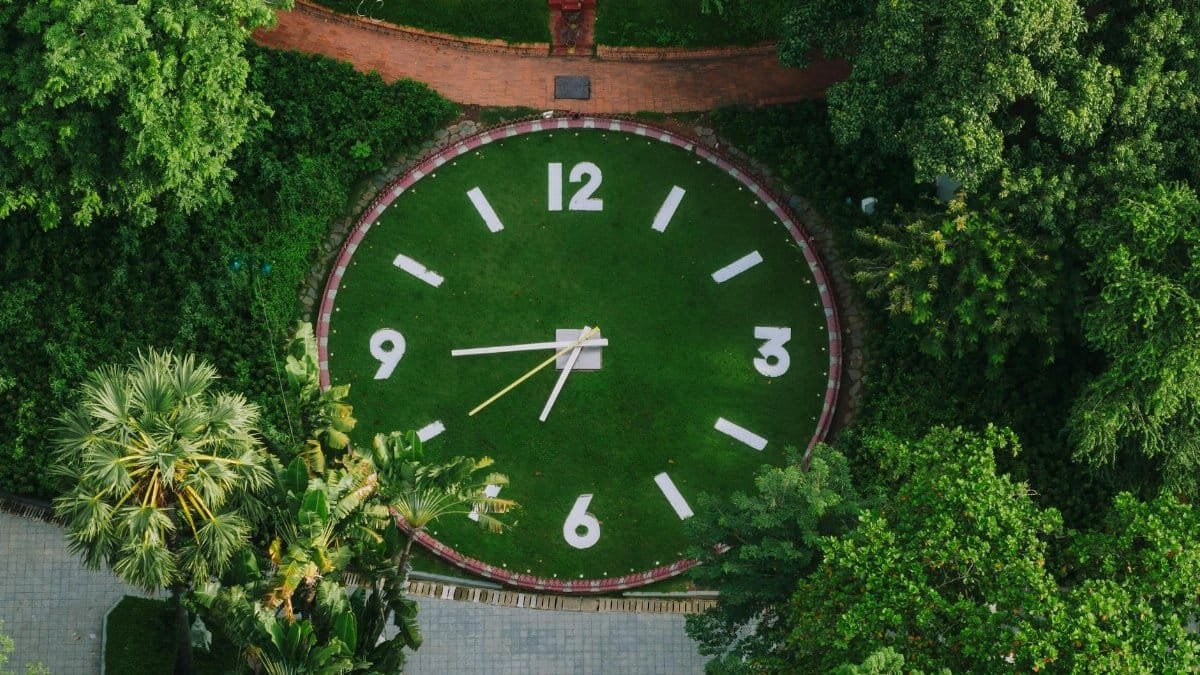 Aerial view of a large outdoor clock set in a green park in Phnom Penh, Cambodia.