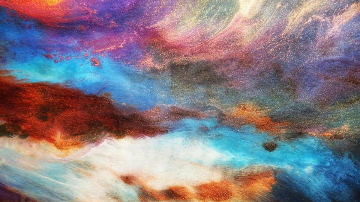 Dynamic abstract art with vivid blues, purples, and oranges creating a mesmerizing visual impact.