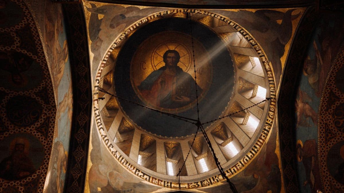 Captivating view of a dome featuring religious art inside a Tbilisi church in Georgia.
