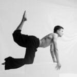 Elegant black and white photo of a dancer balancing on a platform in São Paulo.
