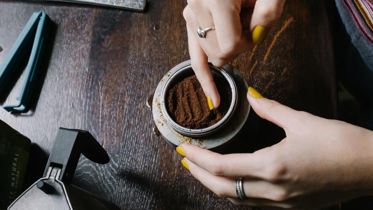 Close-up of hands preparing coffee grounds in İstanbul, Turkey.