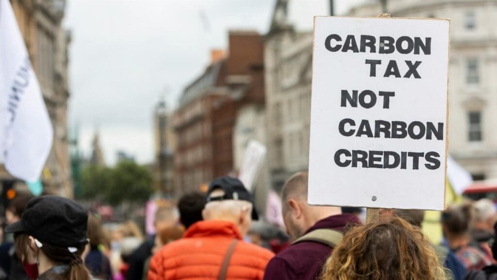 Protesters gather in the city advocating for carbon tax against carbon credits.
