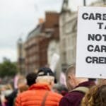 Protesters gather in the city advocating for carbon tax against carbon credits.