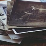 A nostalgic collection of vintage photos and handwritten letters, depicting memories and stories from the past.
