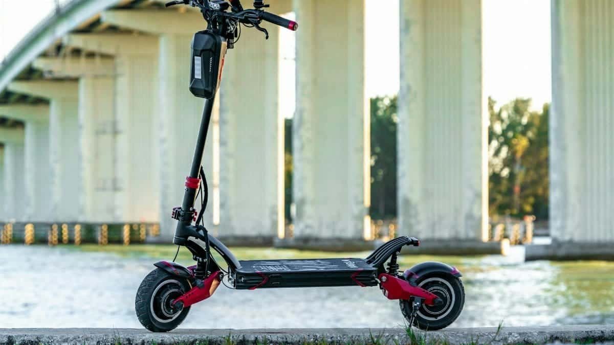 Electric scooter parked by a bridge in San Francisco, showcasing modern urban mobility.