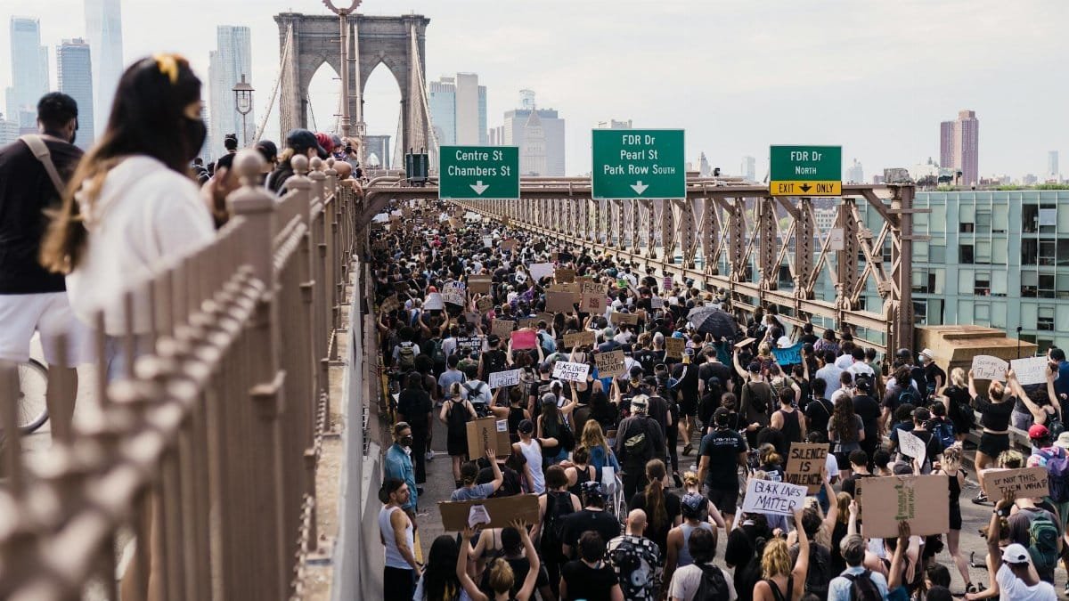 A large crowd protests against racial injustice on the Brooklyn Bridge, NYC.