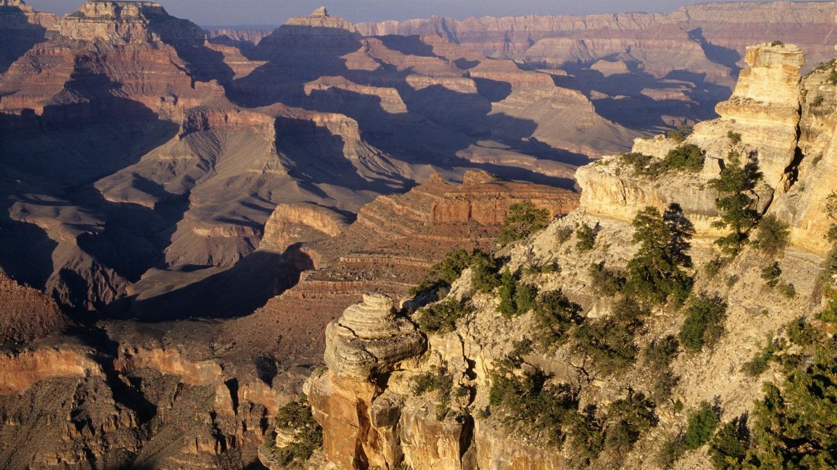 Explore the breathtaking eroded rock formations and vast landscapes of the Grand Canyon, Arizona.