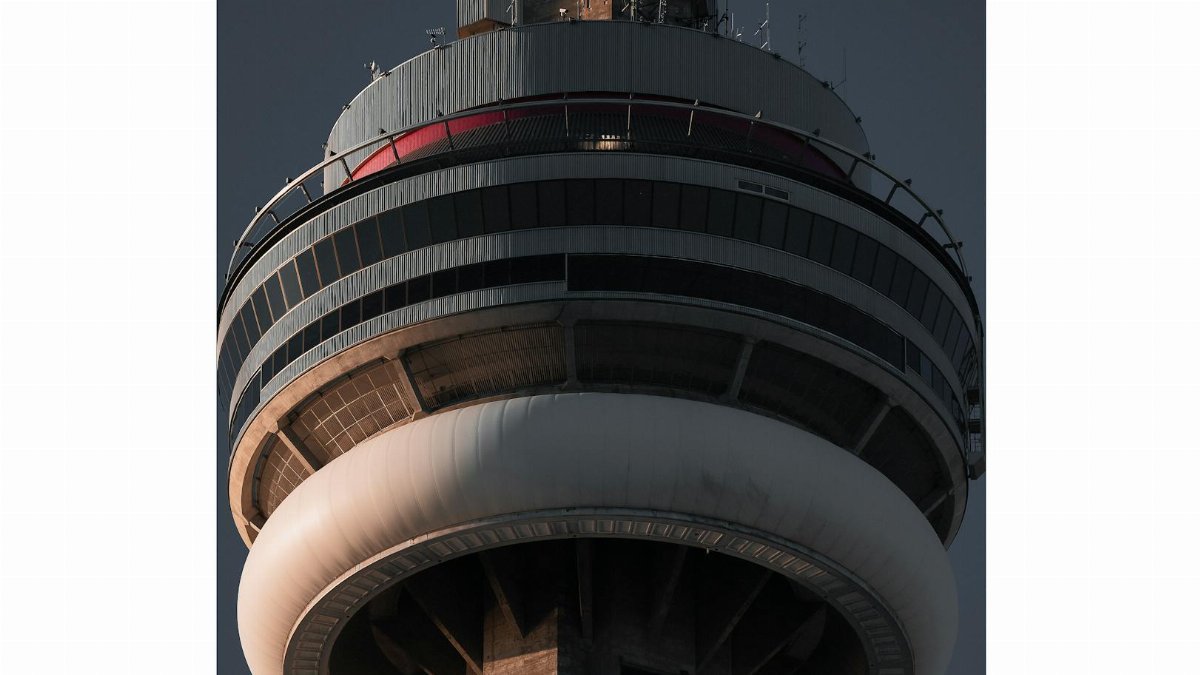 Detailed view of a modern communication tower's observation deck with a circular design.