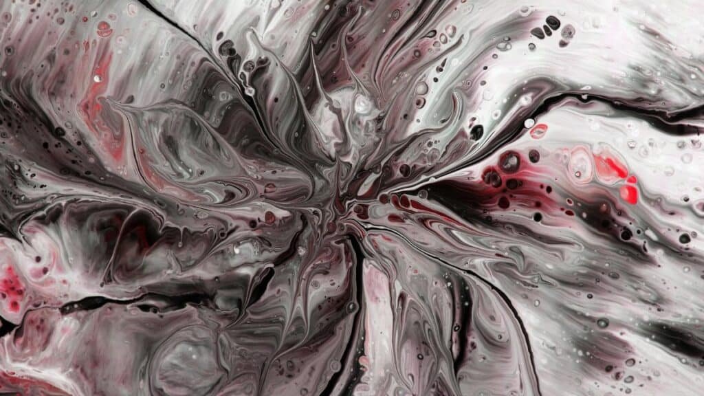 Dynamic black and red abstract fluid art, showcasing intricate patterns and textures.