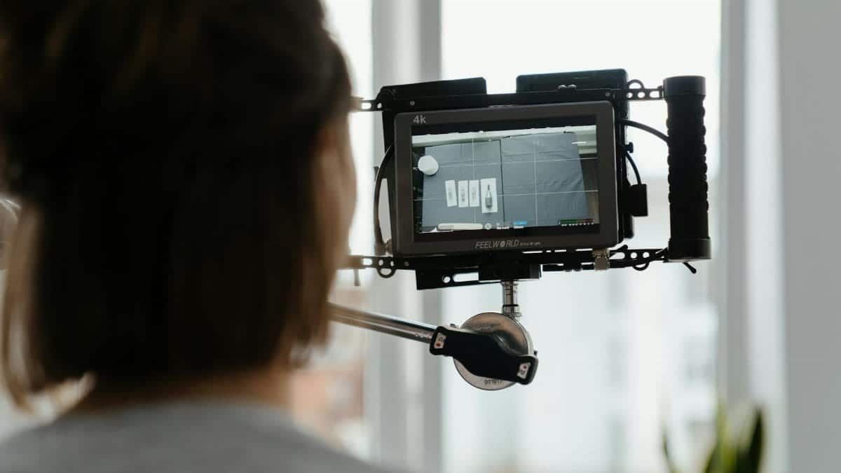 A behind-the-scenes look at a camera monitor displaying footage during a shoot.