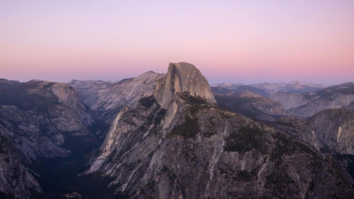 Stunning sunrise over Half Dome in Yosemite, showcasing natural beauty.