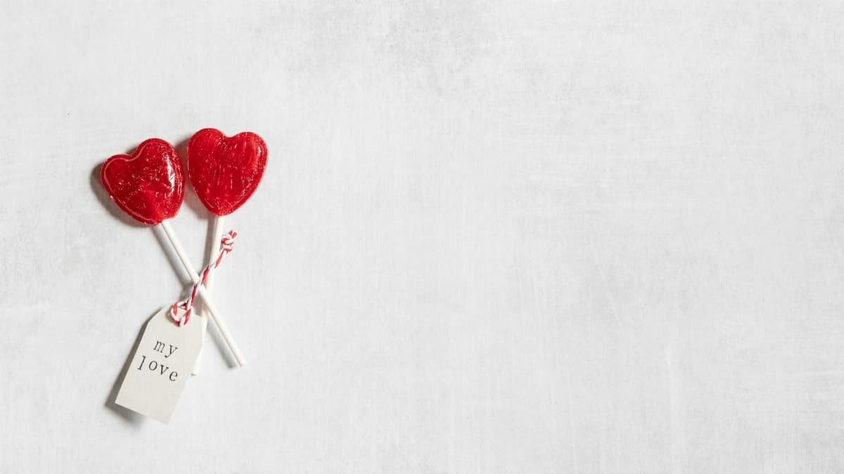 Heart-shaped lollipops with a 'my love' tag, perfect for Valentine's Day.