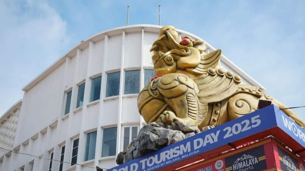 Golden lion statue on a building during World Tourism Day 2025 in Melaka, Malaysia.