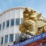 Golden lion statue on a building during World Tourism Day 2025 in Melaka, Malaysia.