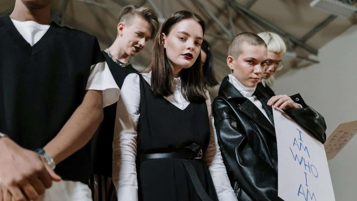 A diverse group of Gen Z individuals showcasing unique style and fashion indoors.