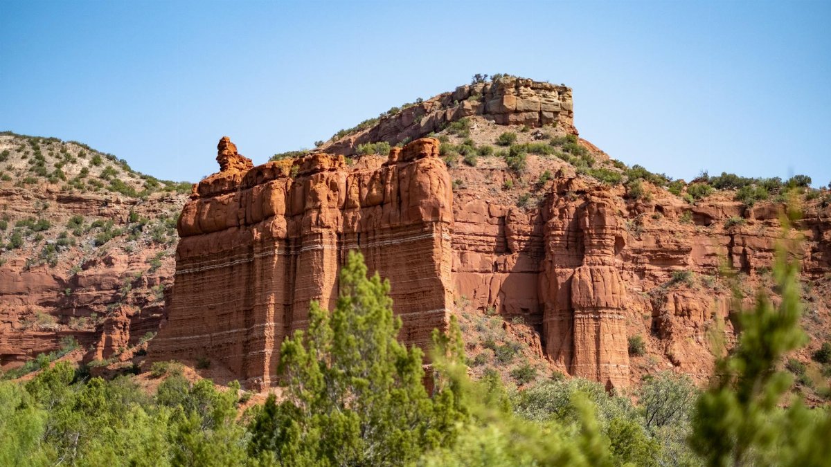 Beautiful red rock formations under a clear blue sky in Quitaque, Texas.