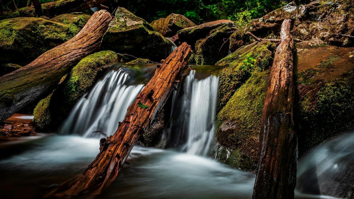 Peaceful waterfall over mossy rocks in Shenandoah National Park, VA.