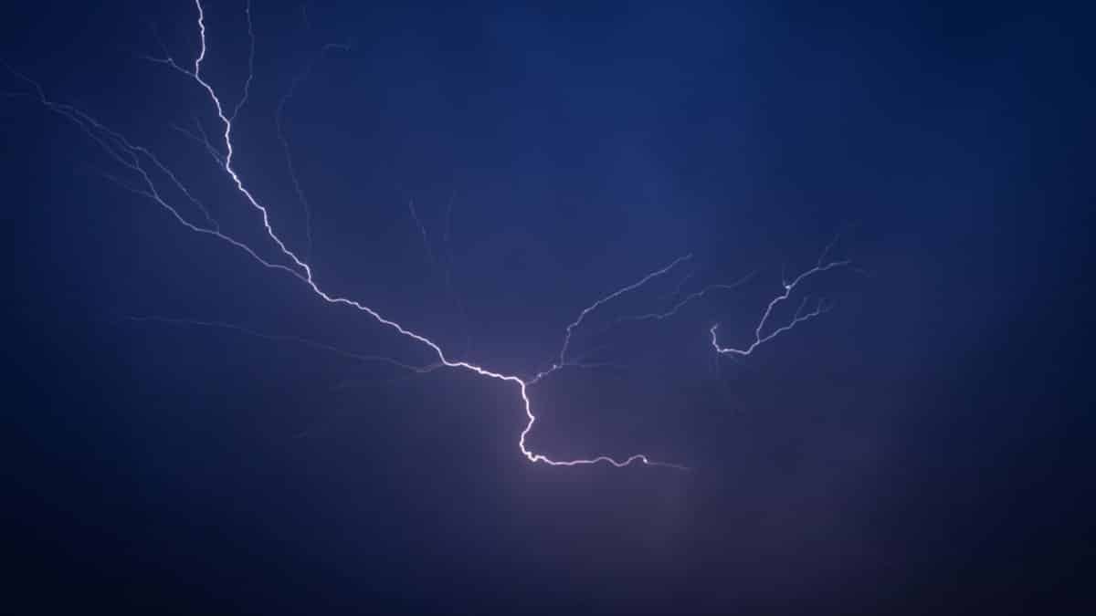 Striking lightning bolt captured at night in a dramatic display of nature's power.