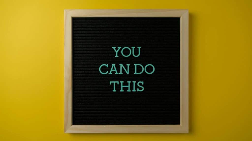 Inspirational message 'You Can Do This' displayed on a blackboard with a bold yellow backdrop.
