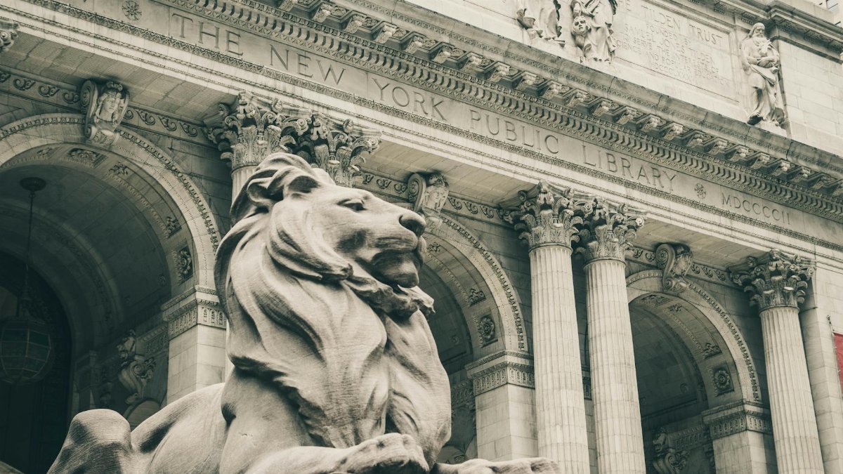 The majestic lion statue guarding the entrance of New York Public Library.