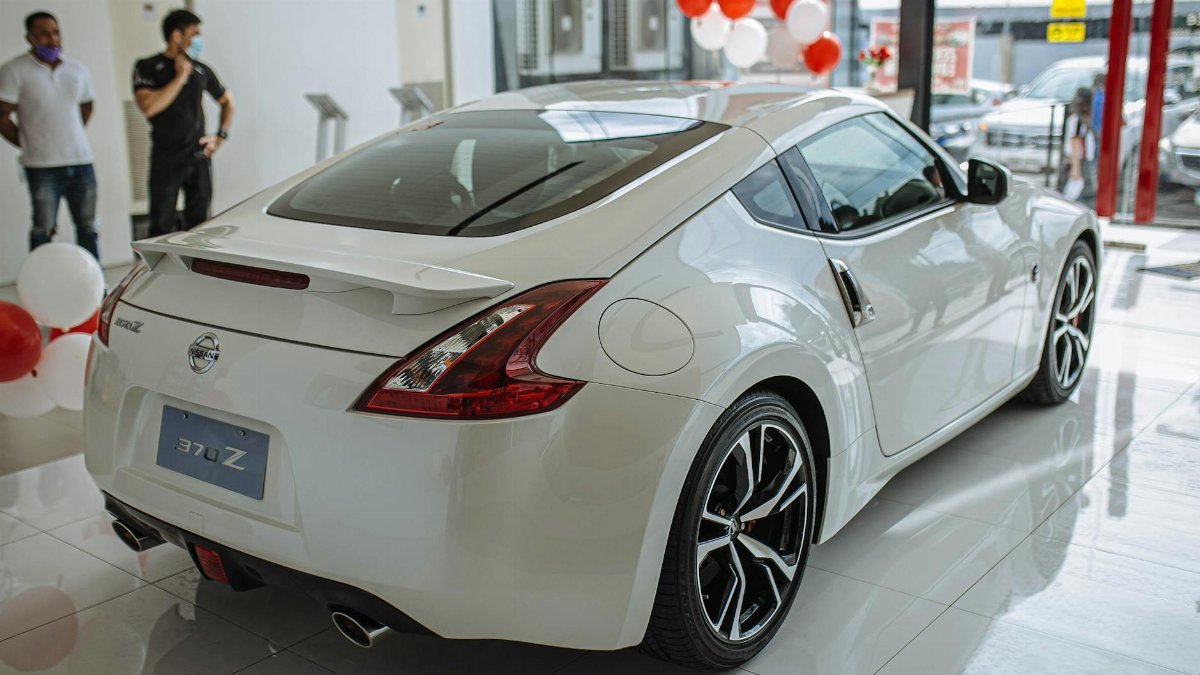 Luxurious Nissan 370Z sports car showcased in a bright showroom, exuding style and performance.
