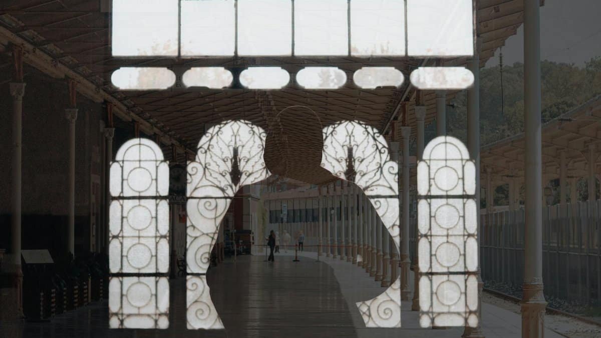 Innovative double exposure blending mosque windows with urban architecture, capturing a unique city view.